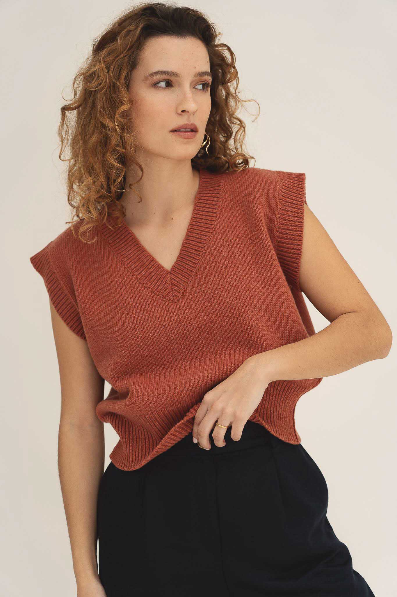 NAZ Alice Knit Vest in Brick. Made with 100% recycled wool.