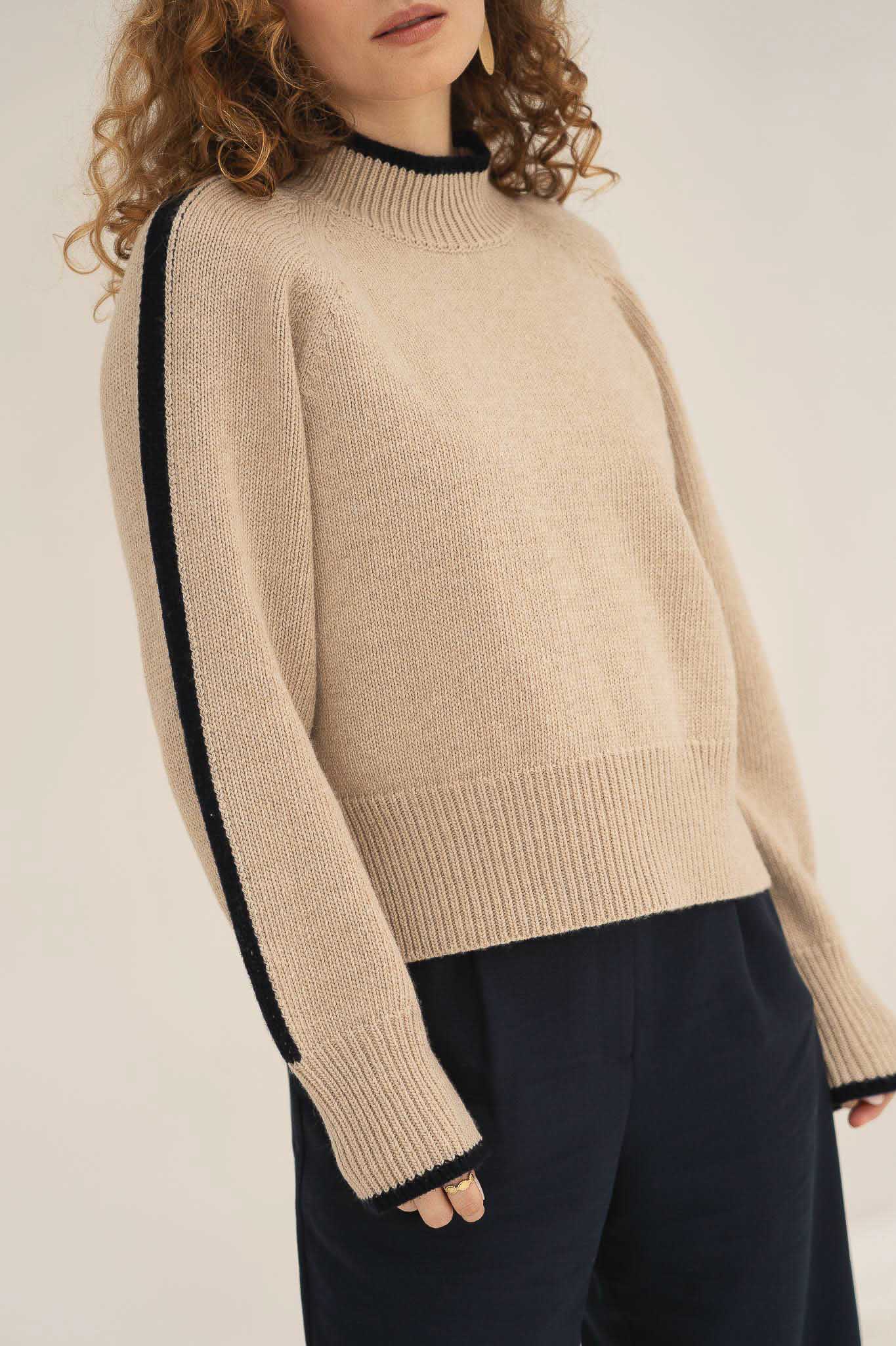 NAZ Agnes Sweater in Beige. Featuring a Navy color block detail. Made with 100% Recycled Wool.