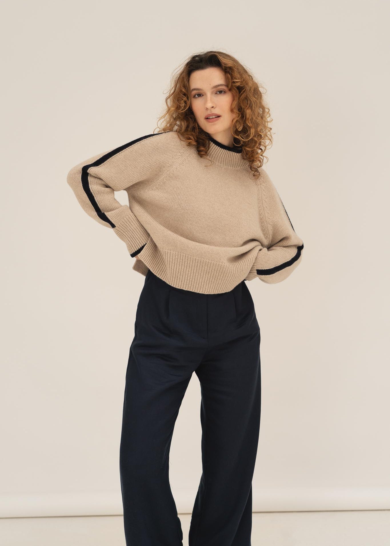 NAZ Agnes Sweater in Beige. Featuring a Navy color block detail. Made with 100% Recycled Wool.