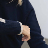 NAZ Agnes Sweater in Navy. Featuring a Beige color block detail. Made with 100% Recycled Wool.