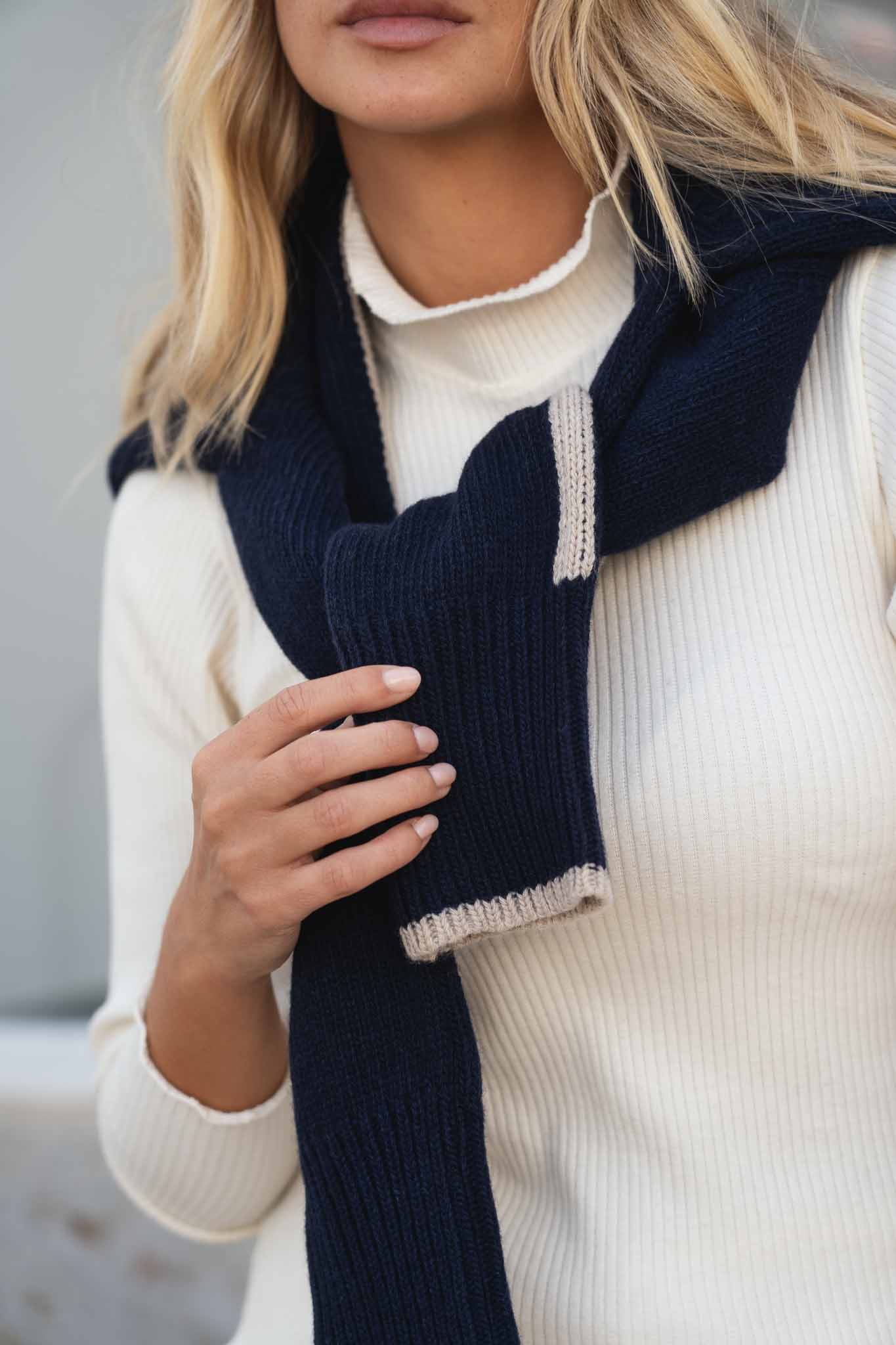 NAZ Ava Turtleneck in Navy. Made with 100% Deadstock Cotton. Produced ethically in Portugal. Paired with the Agnes Wool Sweater in Navy.